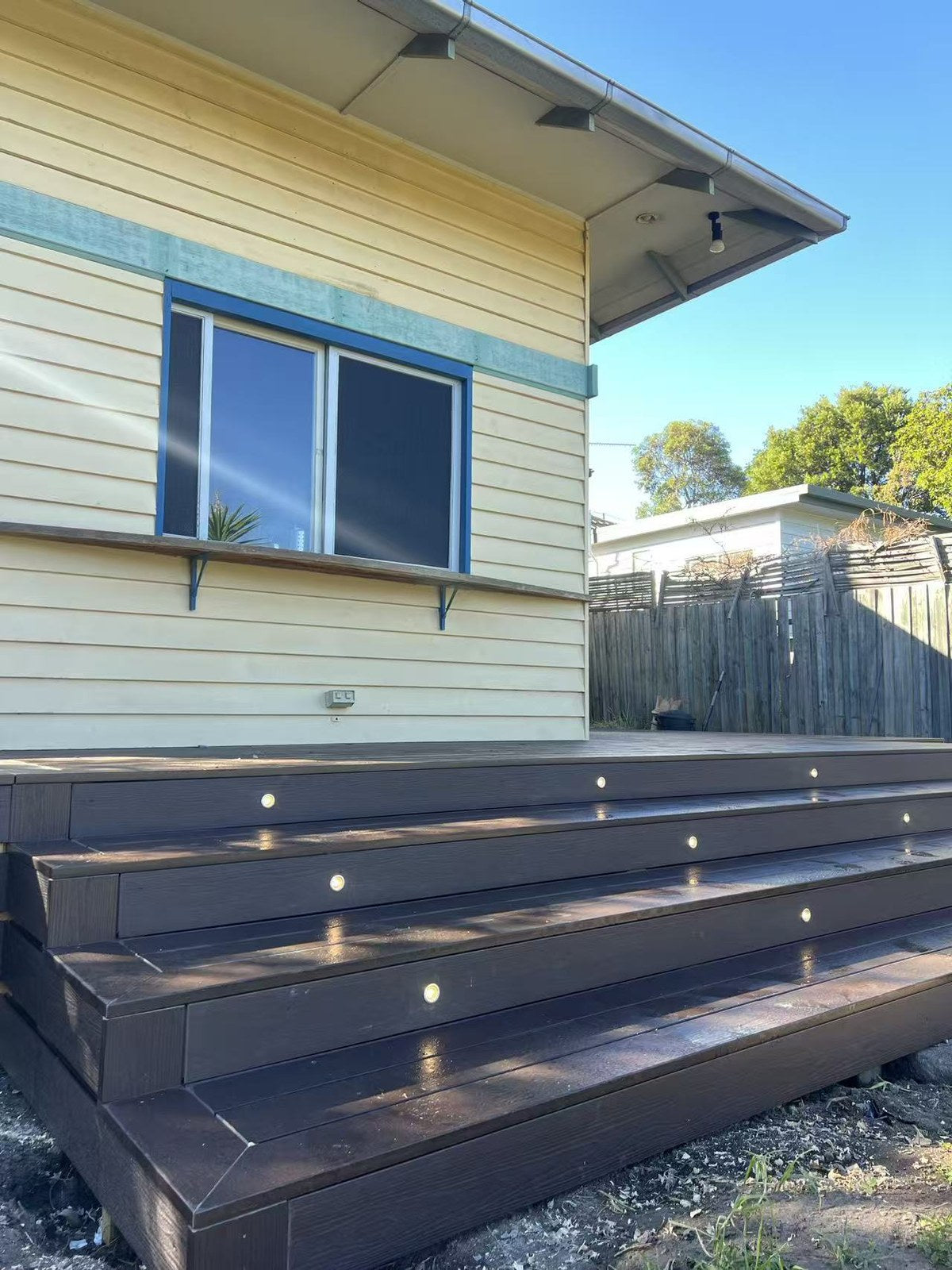 EVERTEX Essence Coco Brownie PVC decking on lit deck steps