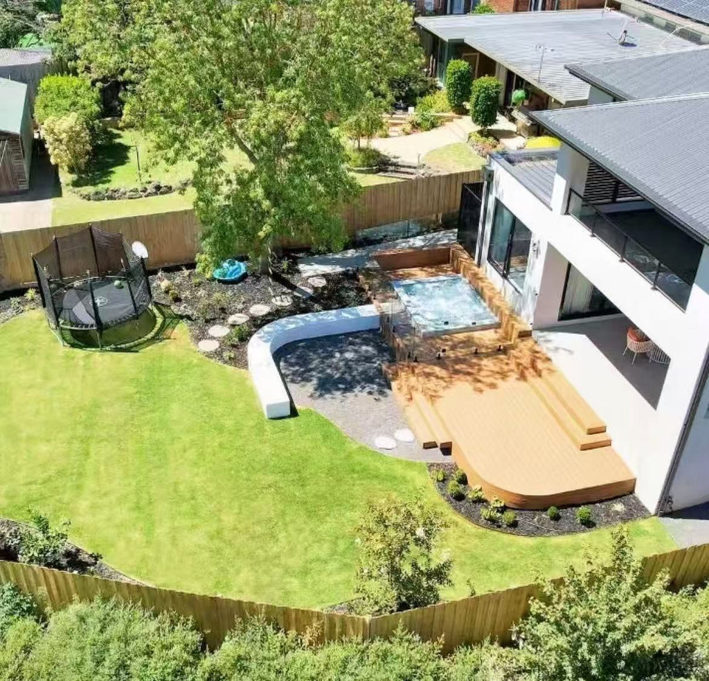 Curved backyard deck built in EVERTEX Essence Gold Teak PVC decking