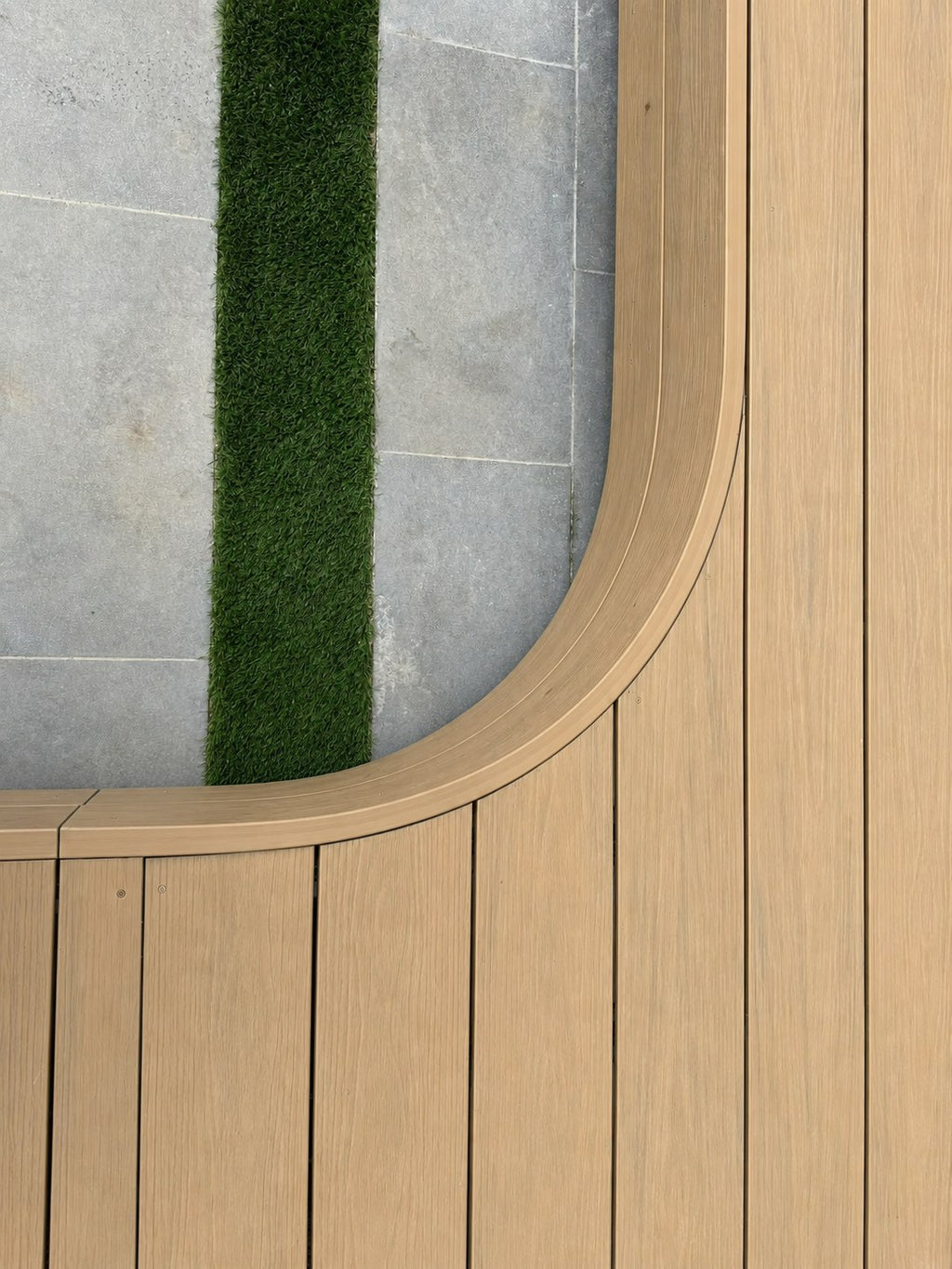 EVERTEX Essence Native Blackbutt PVC decking bent around a curved deck edge
