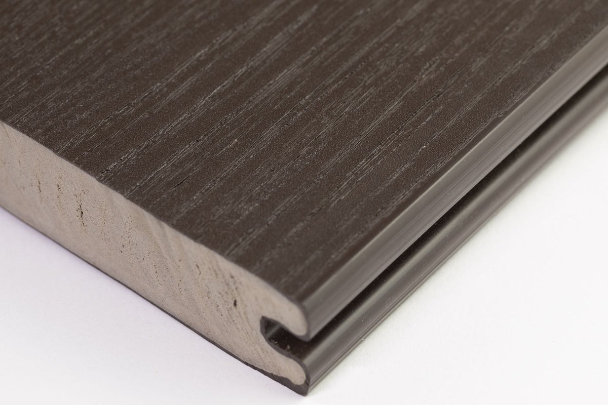 EVERTEX Essence PVC decking board showing the grooved edge and solid PVC core