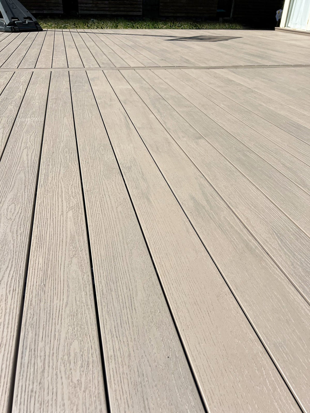 Close-up of EVERTEX Pioneer PVC deck boards with hidden fixings