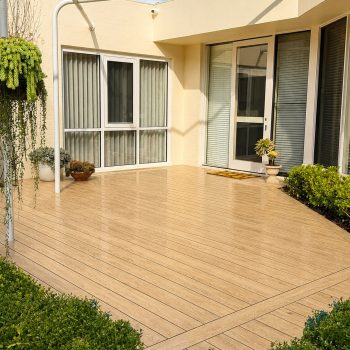 EVERTEX VIVID American Oak PVC decking on a courtyard deck